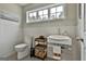 Well-lit half bathroom with a pedestal sink and decorative accents at 2975 Hickory Hill Rd, Brooks, GA 30205