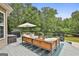 Outdoor deck providing a seating area to enjoy wooded scenery at 2975 Hickory Hill Rd, Brooks, GA 30205