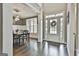 Dining room with wainscoting, a modern chandelier, and a large window offering natural light at 2975 Hickory Hill Rd, Brooks, GA 30205
