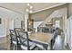 Dining room area with hardwood floors, a modern chandelier, and views of the staircase at 2975 Hickory Hill Rd, Brooks, GA 30205