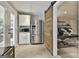 Flex space with a refrigerator, microwave, and large doors leading to the exterior at 2975 Hickory Hill Rd, Brooks, GA 30205