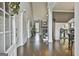 Bright foyer with hardwood floors, high ceilings, and views of the living room and staircase at 2975 Hickory Hill Rd, Brooks, GA 30205