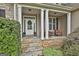 Charming front porch with stone accents, columns, and a welcoming entrance at 2975 Hickory Hill Rd, Brooks, GA 30205