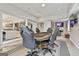Open game room features a poker table, bar, and TV area perfect for entertaining at 2975 Hickory Hill Rd, Brooks, GA 30205