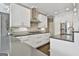 Modern kitchen with stainless steel appliances, white cabinets, and plenty of counter space at 2975 Hickory Hill Rd, Brooks, GA 30205