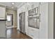 Kitchen featuring built in oven/microwave combo, stainless steel appliances, and hardwood floors at 2975 Hickory Hill Rd, Brooks, GA 30205