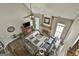 Open living room showcasing a stone fireplace and dark hardwood floors with a ceiling fan at 2975 Hickory Hill Rd, Brooks, GA 30205