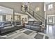 Living room with hardwood floors, neutral paint, and a staircase with a modern railing design at 2975 Hickory Hill Rd, Brooks, GA 30205