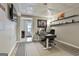 Bright home office with desk, shelving, recessed lights, and access to backyard at 2975 Hickory Hill Rd, Brooks, GA 30205
