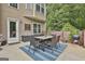 Cozy patio with outdoor dining set, grill, and access to home and backyard at 2975 Hickory Hill Rd, Brooks, GA 30205