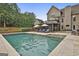 Expansive backyard featuring a large swimming pool, patio, and lush landscaping at 2975 Hickory Hill Rd, Brooks, GA 30205