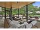 Spacious screened porch with a comfortable seating arrangement, perfect for outdoor entertaining at 2975 Hickory Hill Rd, Brooks, GA 30205