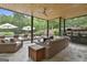 Inviting screened porch with ample seating and views of the pool and landscaped backyard at 2975 Hickory Hill Rd, Brooks, GA 30205