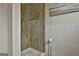 Stylish shower featuring wood-look tile at 2975 Hickory Hill Rd, Brooks, GA 30205