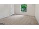 Bedroom with a window view and neutral colored carpet at 368 Hemlock Ln, Locust Grove, GA 30248