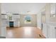 Cozy dining area with views of the yard, bright lighting, and wood flooring creating a warm space at 368 Hemlock Ln, Locust Grove, GA 30248