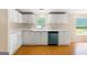 Functional kitchen featuring white cabinets, light counter tops, and modern appliances perfect for home cooking at 368 Hemlock Ln, Locust Grove, GA 30248