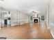 Spacious living room featuring wood floors and a fireplace creating a warm and inviting ambiance at 368 Hemlock Ln, Locust Grove, GA 30248