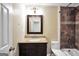 Updated bathroom features stylish beadboard, granite counters, and a dark-stained vanity at 602 Pine Knoll Court, Mcdonough, GA 30252