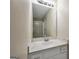 Bathroom with a white vanity, large mirror, and a shower with glass doors at 602 Pine Knoll Court, Mcdonough, GA 30252
