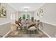 Cozy dining room with modern chandelier and dining table set at 602 Pine Knoll Court, Mcdonough, GA 30252