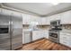 Modern kitchen with stainless steel appliances and a beautiful backsplash at 602 Pine Knoll Court, Mcdonough, GA 30252