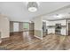 Open concept living area with stainless appliances and wood-look flooring at 602 Pine Knoll Court, Mcdonough, GA 30252