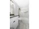 Updated bathroom with white cabinets, granite counters, and decorative tile surround at 1432 Almand Creek Drive Sw, Conyers, GA 30094