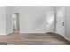 The bedroom features wood-look floors, neutral walls, and a closet at 1432 Almand Creek Drive Sw, Conyers, GA 30094