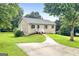 Charming single-story home featuring a well-manicured lawn and inviting front walkway at 1432 Almand Creek Drive Sw, Conyers, GA 30094