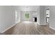 Spacious living room with wood-look floors, neutral walls, and natural light at 1432 Almand Creek Drive Sw, Conyers, GA 30094