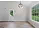 A second room features wood-look floors, neutral walls, and a door to a bedroom at 1432 Almand Creek Drive Sw, Conyers, GA 30094