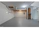 Unfinished basement with concrete floor, exposed ducts, and white painted walls, providing ample storage space at 1432 Almand Creek Sw Dr, Conyers, GA 30094
