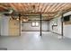 Unfinished basement with concrete floor, exposed ceiling, and window views to the outside, ready for customization at 1432 Almand Creek Sw Dr, Conyers, GA 30094