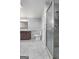 Bathroom featuring a walk in shower, tile floor, and a vanity with a double sink at 7972 Woods Lane, Jonesboro, GA 30236