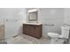 Bathroom featuring a double sink vanity with drawers and towel racks at 7972 Woods Lane, Jonesboro, GA 30236