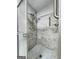 Walk in shower with custom tile and shower head, plus ADA grab bars at 7972 Woods Lane, Jonesboro, GA 30236