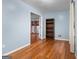 A secondary bedroom connects to a spacious living room at 7972 Woods Lane, Jonesboro, GA 30236