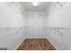 Walk-in closet with wire shelving and hardwood floor at 7972 Woods Lane, Jonesboro, GA 30236