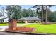 Well-maintained brick home with a beautiful lawn and landscaping at 7972 Woods Lane, Jonesboro, GA 30236