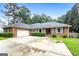 Charming single story brick home with attached garage and inviting curb appeal at 7972 Woods Lane, Jonesboro, GA 30236