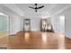 Open living space with hardwood floors, neutral walls, and a view of the backyard at 7972 Woods Lane, Jonesboro, GA 30236
