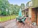 Outdoor deck features a screened in porch with a seating area, great for relaxation and entertaining at 7972 Woods Lane, Jonesboro, GA 30236