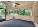 Spacious screened porch with a ceiling fan, perfect for enjoying outdoor living at 7972 Woods Lane, Jonesboro, GA 30236