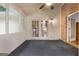 Cozy outdoor screened porch featuring a ceiling fan, providing a great view at 7972 Woods Lane, Jonesboro, GA 30236