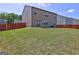 Large backyard with a spacious lawn and a privacy fence at 237 Cranapple Ln, Mcdonough, GA 30253
