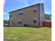 Exterior view of home, showcasing a spacious, grassy backyard with a wood fence at 237 Cranapple Ln, Mcdonough, GA 30253