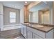 Bright bathroom featuring a double vanity, soaking tub and glass shower at 237 Cranapple Ln, Mcdonough, GA 30253