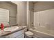 Clean bathroom with shower-tub combo, single sink vanity, and tile flooring at 237 Cranapple Ln, Mcdonough, GA 30253
