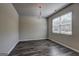 Bright dining area with wood flooring and natural light from a large window at 237 Cranapple Ln, Mcdonough, GA 30253